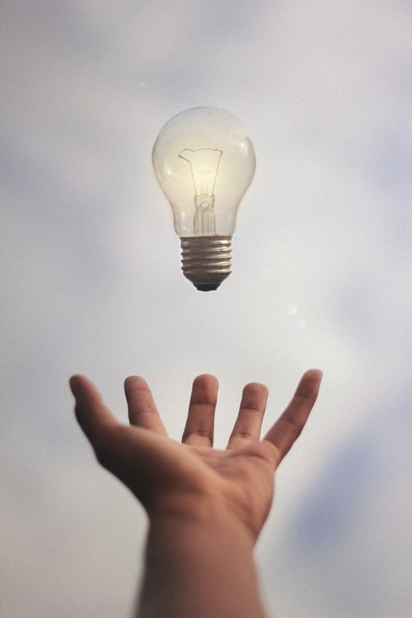 hand sustaining lightbulb which floats in the air